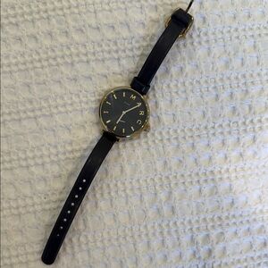 Marc Jacob’s Black leather strap and Gold hardware Watch